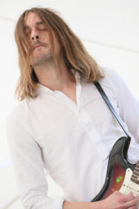 Joachim Svensmark (electric guitars, slide guitar, percussion, backing vocals)