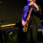 Jono Martin (bass, backing vocals)