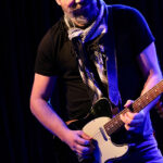 Kris Pohlmann (lead vocals, electric guitars, slide guitar)