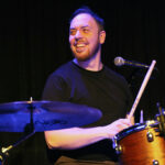 Roman Midleja (drums, percussion, backing vocals)